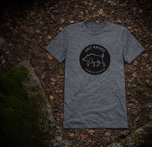 Gray t-shirt with 'Grit Knives' logo on a forest floor background